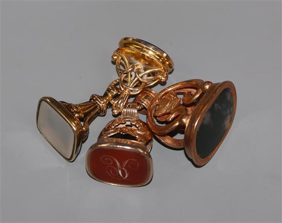 Four assorted 19ct century yellow metal overlaid and carnelian set fob seals.